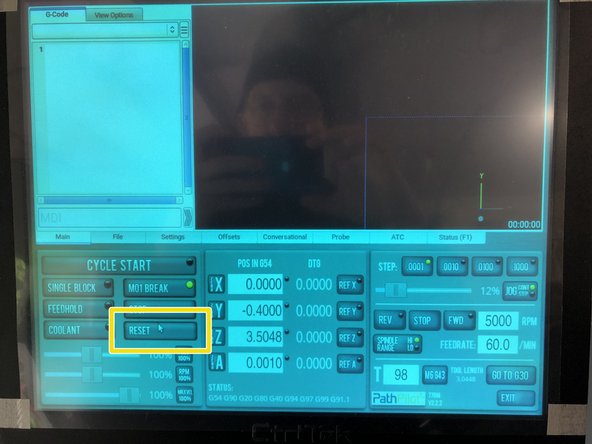 Release the E-stop by twisting it clockwise.  It should spring up when it releases.
