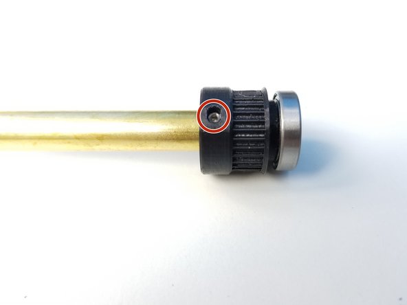 Insert 6701 bearing on the small 3/8' Pulley Gear and align the set screw hole to the other end of the Ulna Gearbox Shaft (3/8' Brass Tube)