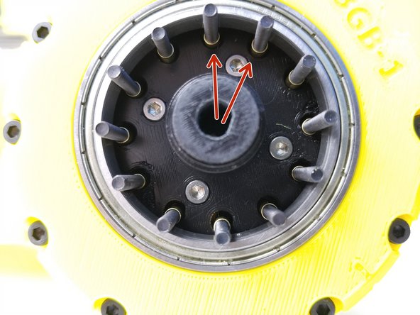 While keeping the Gearbox on its side, insert 3.5x18.5mm Brass Tubes on each Screws