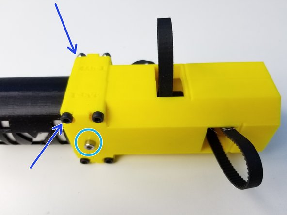 Align one of the Elbow Tail Housing's TOP side with the Ulna Gearbox 's TOP side