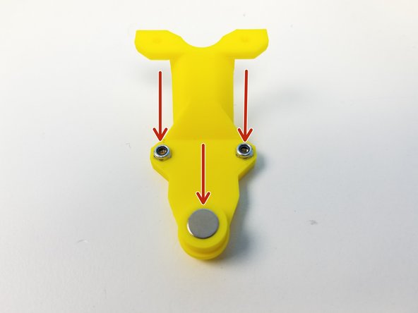 Insert M3 Nylock Nuts and Neodymium Magnet into the Elbow Magnet Holder Bottom