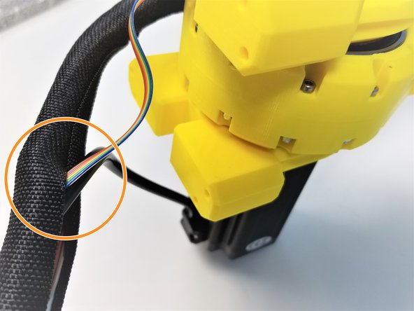 Loop the Braided Cable all the way around the Shoulder Gearbox up to when it reaches 180 degrees