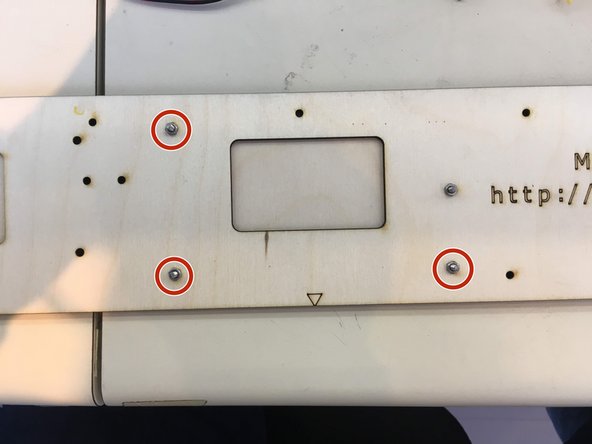 Insert M3 x 10 screws through the indicated holes and thread 4 M3 hex nuts and tighten