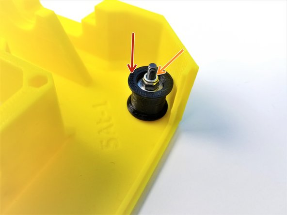 Insert another one of the Bearing Sleeves on the M3x20mm Screws but this time with the flanged part facing up