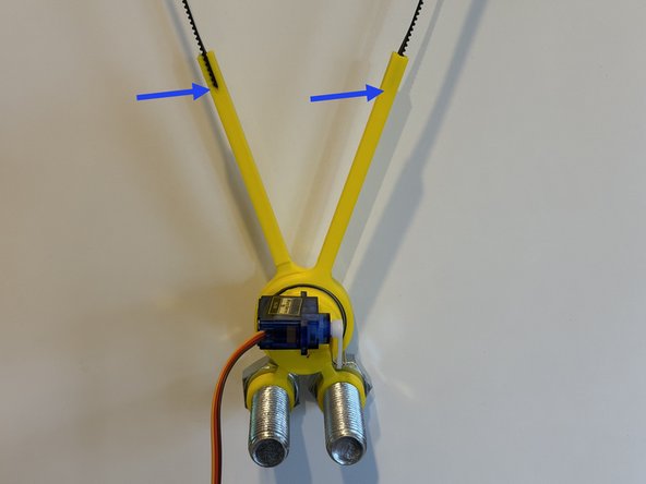 Press the servo horn onto the servo gear at a right angle to the body of the servo.  This is an educated guess that might be tweaked later.