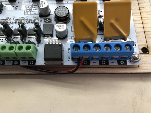 Strip the other end of the red/black wires and screw them into the terminal blocks as indicated.  Note that red wire goes to the positive (+) terminal and black to the negative (-).