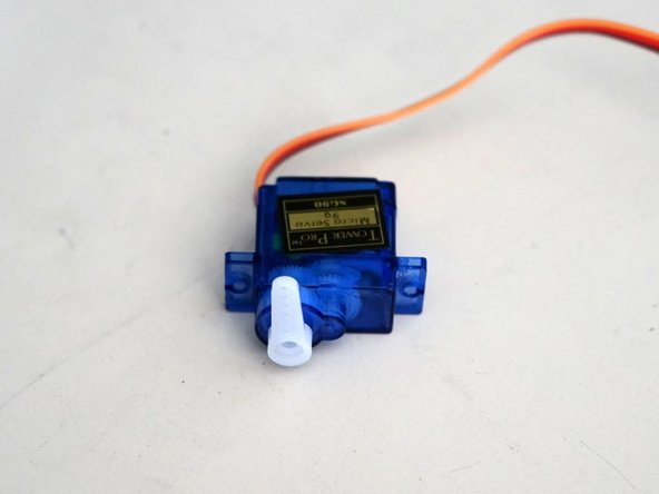 Attach the servo to an Arduino and drive the output gear to 90 degrees.
