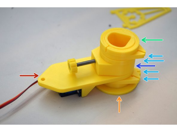 Put one pair of clips onto the center tube.  They should drop all the way to the bottom.  Pay special attention to the direction of the q-p holes, they must match the photo.