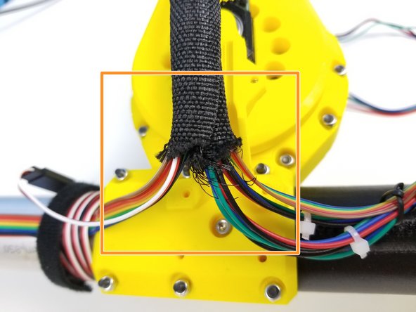 Insert all the Elbow Tail Motor Cables and Ulna Sensor Cables to the Braided Cable Sleeve as well.