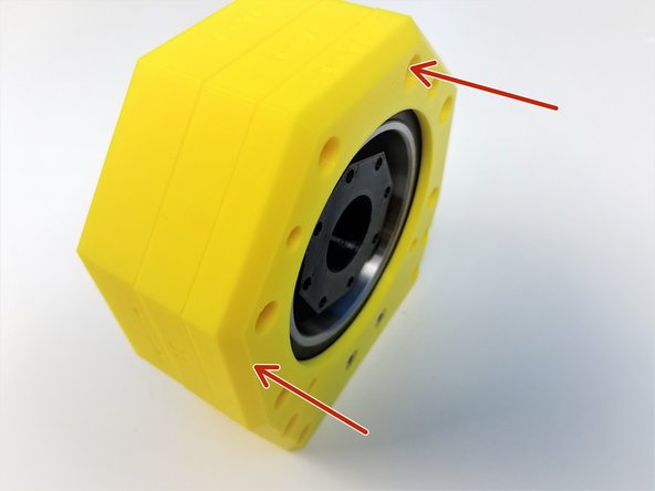 Insert the Top Bearing &amp; Spacer Housing  (assembled in Step 10) over the Roller Housing. (Hex standoff should fit right in)