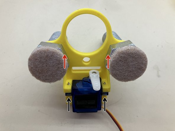 Use the screws from the servo kit to attach the servo to the main body.