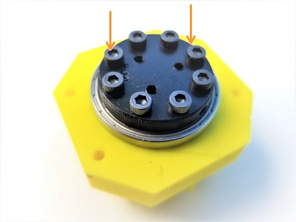 Insert the Assembled Output Disk pins through the Rotors