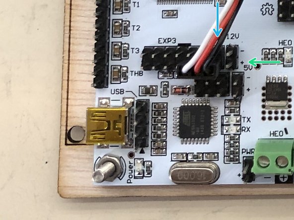 Attach the male end of the servo extension cable.  Note how the black wire is on the south row, eastern-most pin of EXP3...