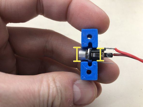 Solder the red wire to the west pole of the power connector following the same techniques used for the switches.