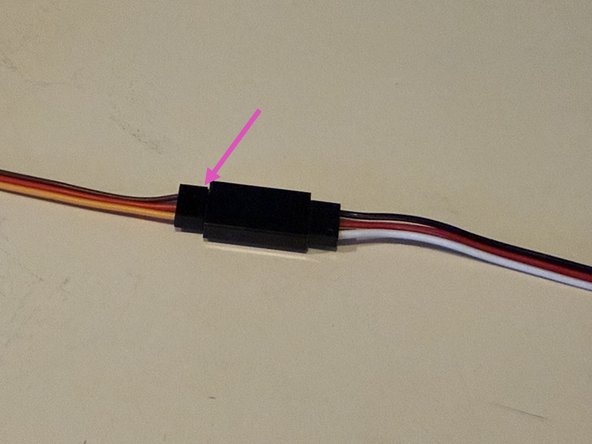 The smaller screw can be added here to secure the horn.  Probably best to save it until after you have run the machine at least once and confirmed the horn angle is correct.