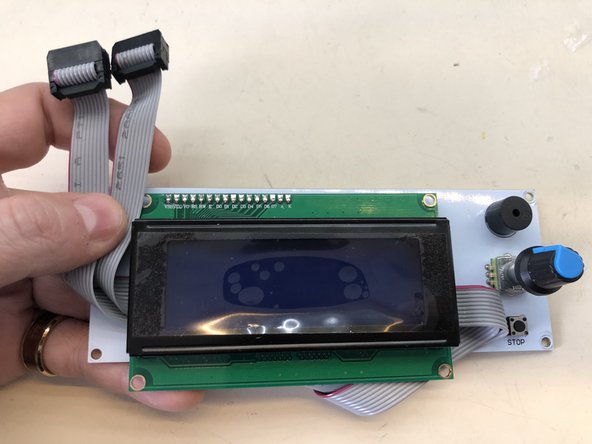 ...and gently fit it behind the LCD screen.