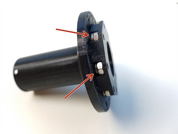 Insert M4 Nylock Nuts into the Output Top Bearing [one with the long tube]