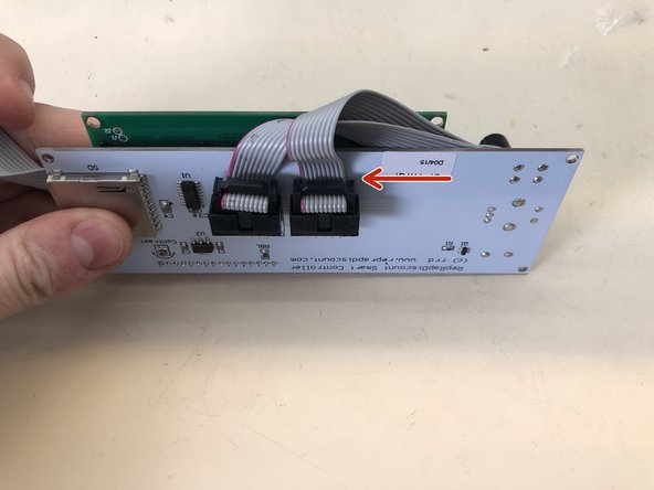 Attach the ribbon cables to the LCD panel.  Note the orientation of the red line against the PCB.