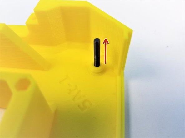 Insert the M3x20mm Screw in to the Fork Half where there's a chamfered peg on the inner face