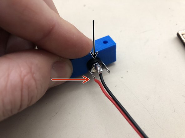 Solder the black wire to the north pole of the power connector following the same techniques used for the switches.