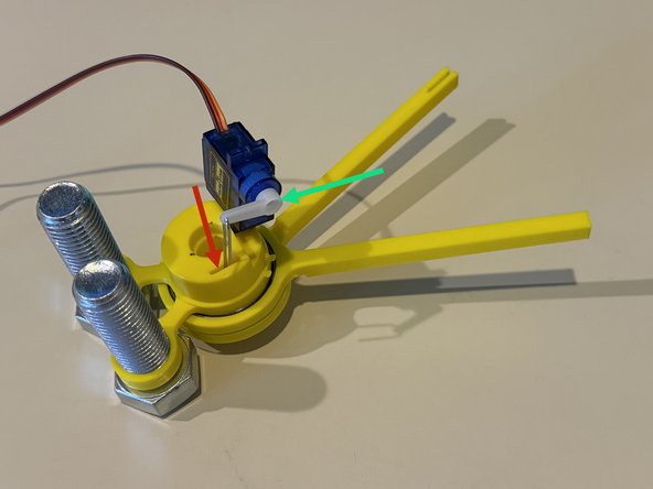 Insert one end of the paperclip into the body slot.