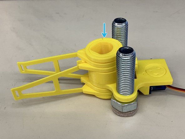 Rotate the collet so that the top of the teardrop shape is away from the M4 screw.