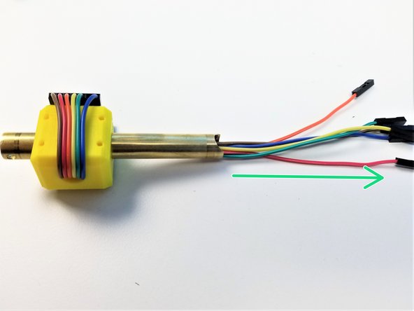 One wire at a time, feed the jumper wires through the Brass Tube