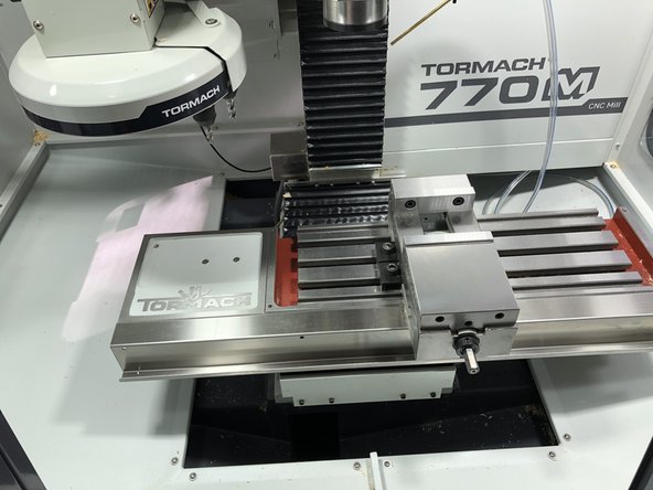 Inspect the interior of the machine.  Confirm the last user cleaned out the swarf and did not leave equipment in the machine.  In this picture someone has left behind a vise.