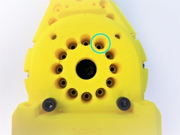 Insert the Motor Side of Shoulder Gearbox Bottom and secure it with M3 Nylock Nuts using the Alan Key and Socket Driver