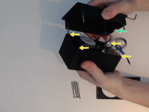 put the back plate over the timing belt so that the M3x35 screws go through the matching holes.