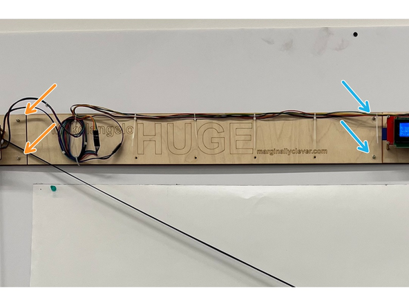 Using an M3 alan key (hex key), undo the screws that hold the left and right sides together.  A Torx T10 will also work.
