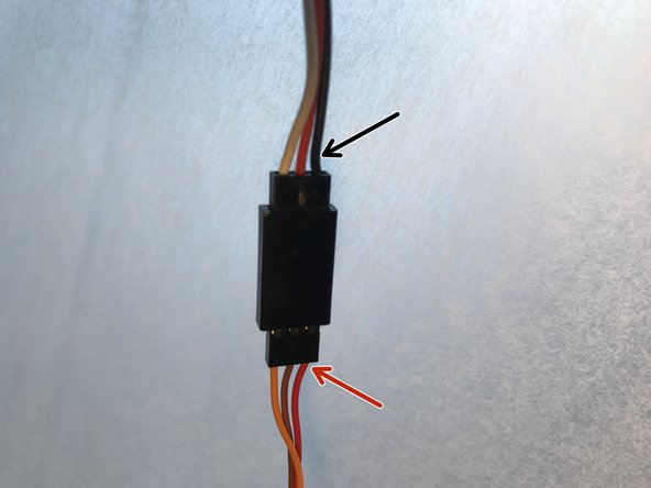 On a Makelangelo 5, place the servo cable over the left hand motor.  On a HUGE, place it over the right hand motor.  This makes sure the cable doesn't touch the pen while drawing.