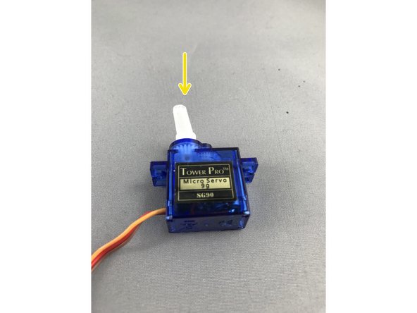 Press the servo horn onto the output shaft.