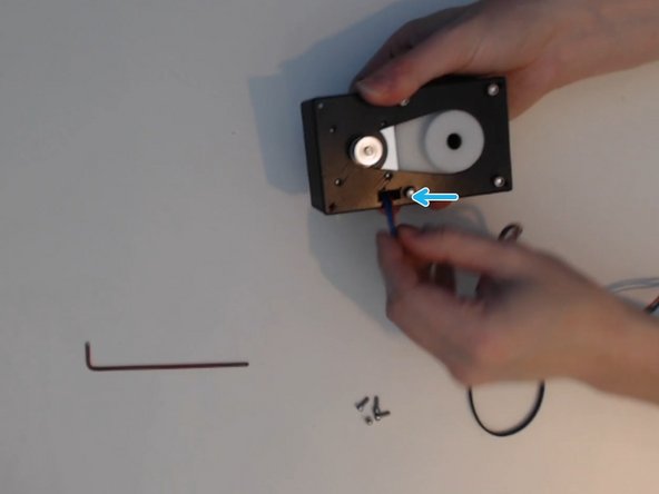 attach the pulley to the gearbox if it is not already done.  The pulley tightens onto the motor shaft with an Alan key.  At least one of the set screws should be on the flat side of the shaft.