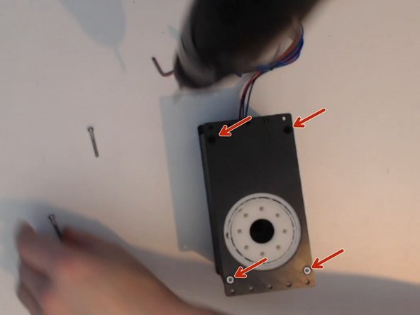 Fit the output plate over the gearbox and install the four M3x25 screws.