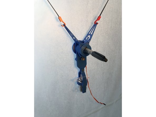 Slide in a sharpie and secure it with the screw. The tip should be pointing out just enough to touch painting surface when mini-servo is not in the extended position