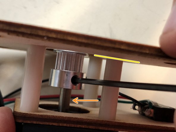 slide a GT2-20 pulley onto the motor shaft until the thin end is flush with the inside of the back plate.