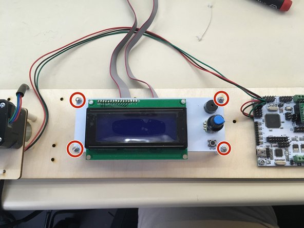 attach the LCD ribbon cables to the LCD panel with both pink lines to the left as shown in picture