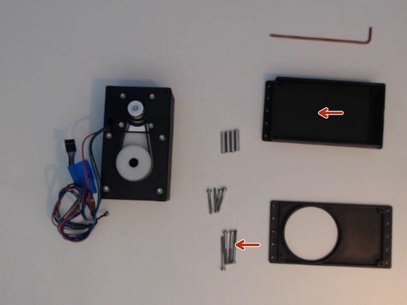 Insert the M3x35 screws into the back plate