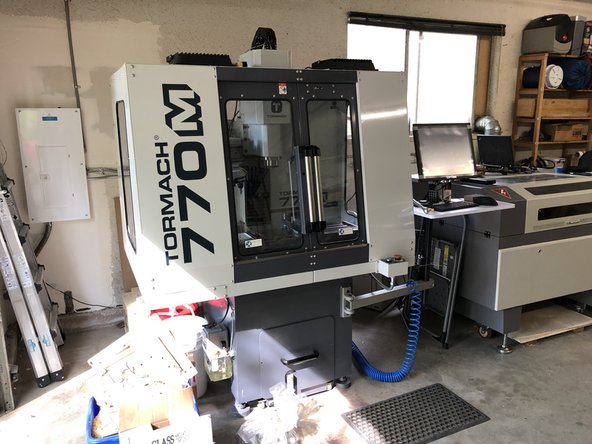 The air compressor switch should be off when you approach the machine.  In this picture it is in the OFF position.  Twist clockwise to AUTO.  Compressor should come on and begin filling with air.