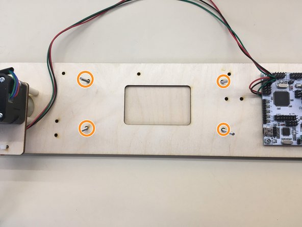Insert four M3 x 35 screws into the indicated holes