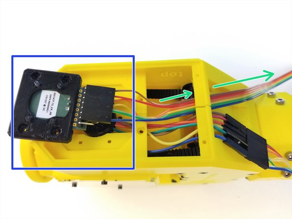 Insert the Wrist Sensor Cable {Female} through the Cable Clamp