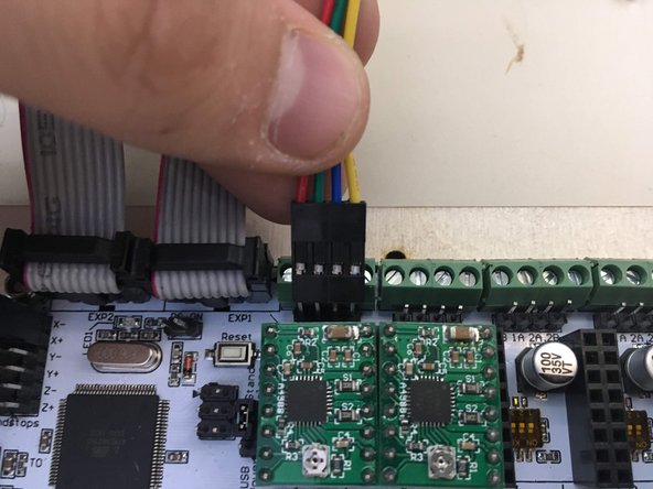 Plug the left motor into the left set of pins and the right motor into the right set