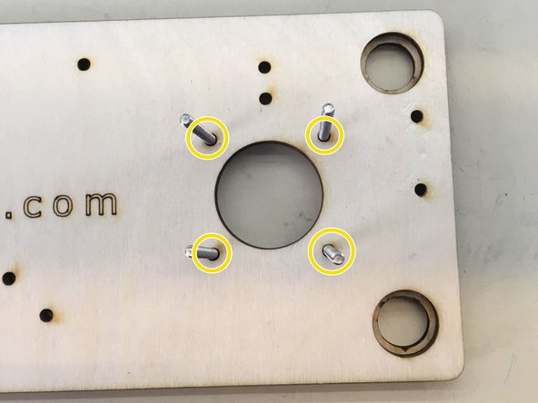 Insert four M3 x 35 screws through indicated holes