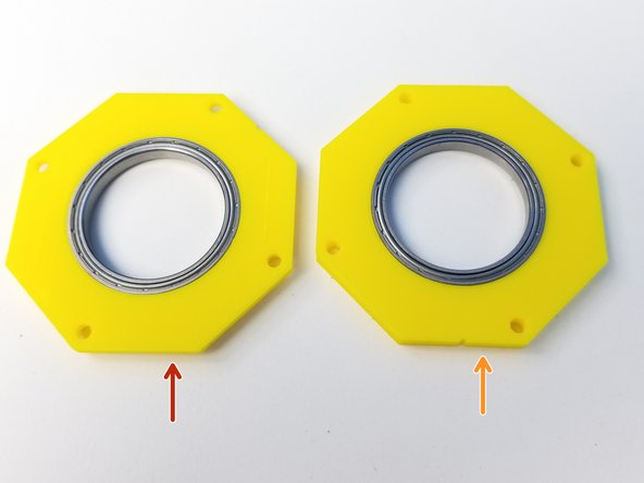 Insert 6706 Bearings into two Top Housing parts
