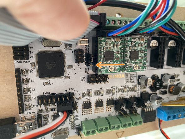 Using a tool with a fine tip, press the dip switches from north (default) to south.  The dip switches set the microstepping.  The firmware expects all switches to be down for 1/16th microstepping.
