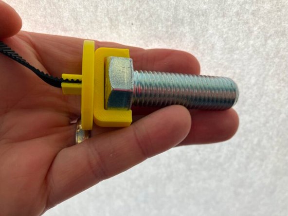 If you have an older model disc, the hole will be larger than the Y clip.  The disc has a rectangular hole.  Make sure the long/wide side of the rectangle is touching the belt to ensure a snug fit.  Try to center the hole on the hook.