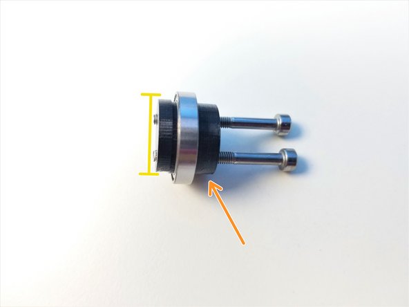 Notice that the thinner piece of the Shaft Holder has 2 sides, one where screw lined up to the center of the face and other which is eccentric