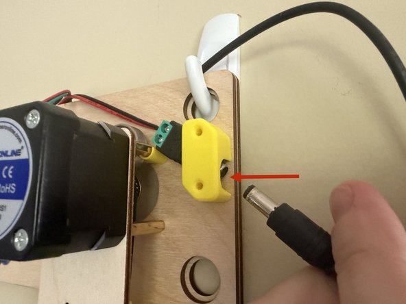 Your 12v2a power supply connects on the right side of the machine.