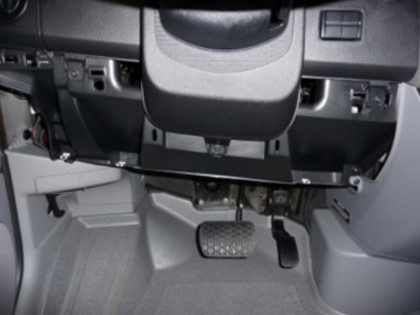 Pull the larger panel to release the upper clips and carefully set panel aside.